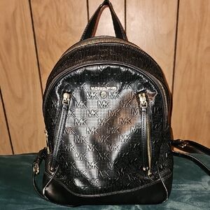 Michael Kors Shiny Black Backpack with Gold Details